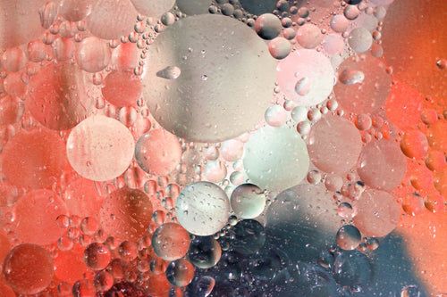 Oil droplets suspended in water, close up