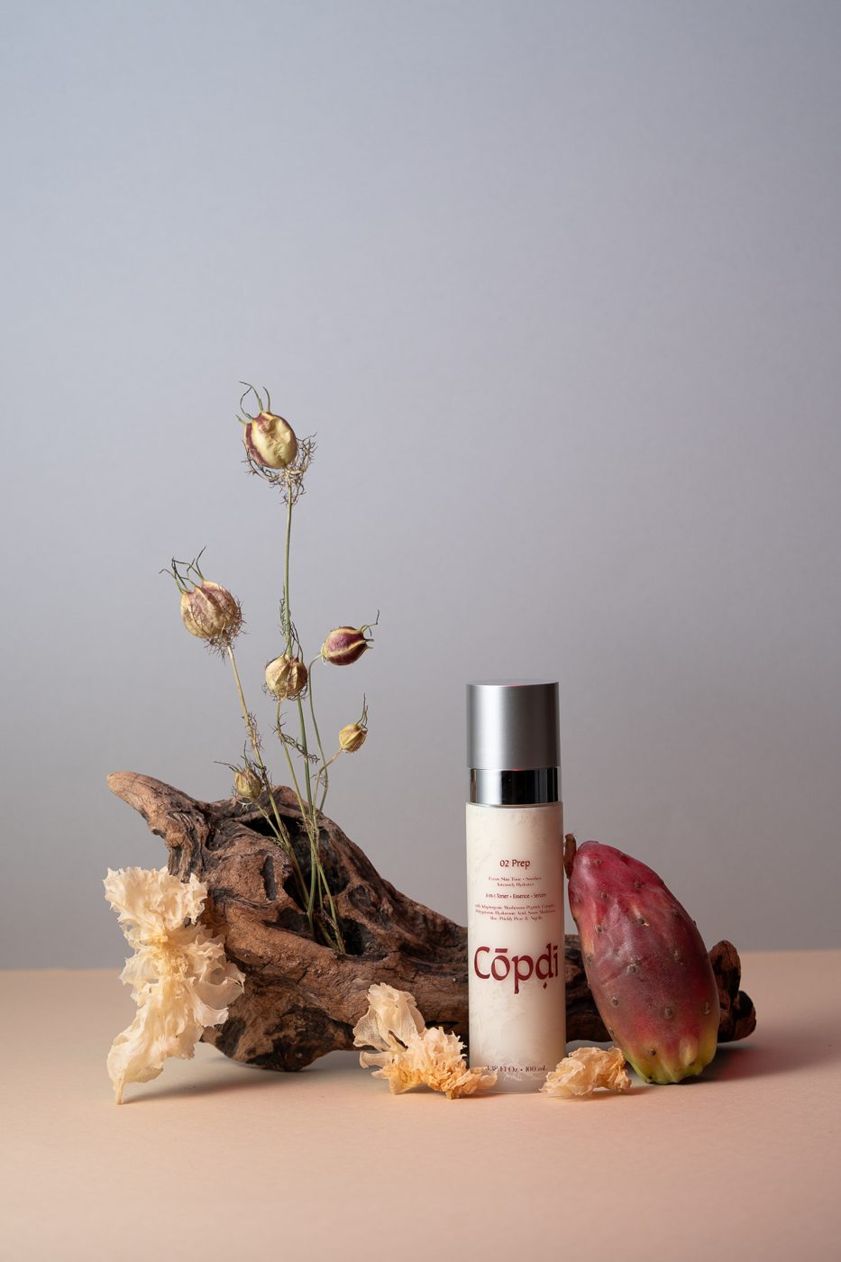 Cōpḍī Prep bottle with dried nigella flowers and prickly pear